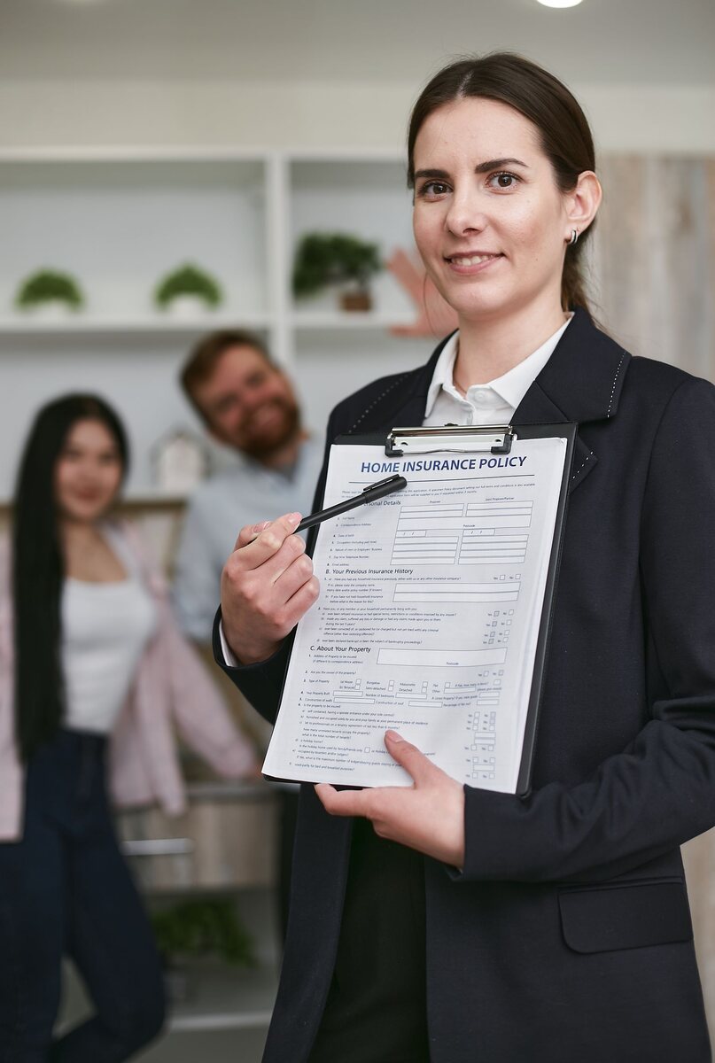 A woman presenting an insurance document to a client